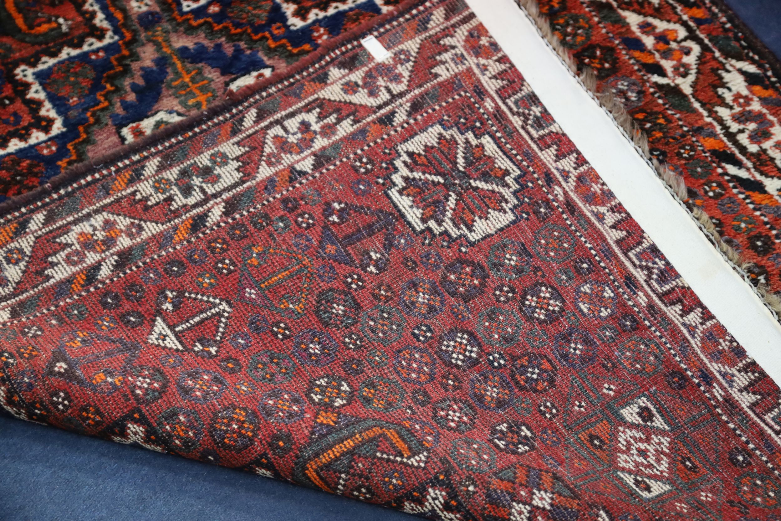 A Shiraz design red ground rug, with central polygon in a field of flower heads and three row - Image 3 of 3