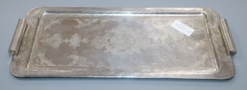 A Persian engraved white metal rectangular two handled tray, 47.1cm, 996 grams.