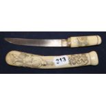 A Japanese Meiji carved staghorn dagger