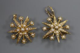 Two Edwardian 15ct gold and seed pearl set starburst pendant brooches, 26mm, gross 8.2 grams.