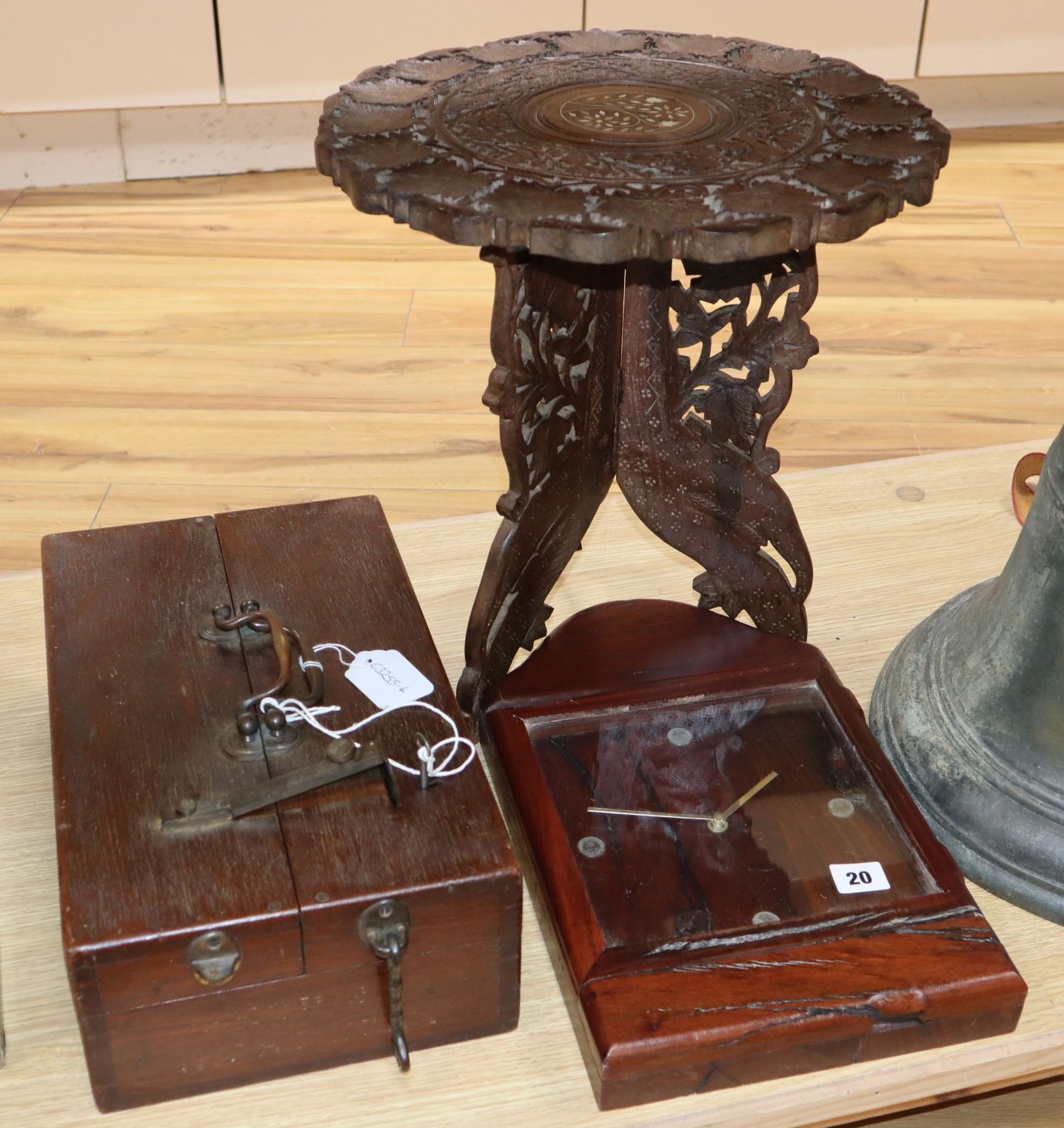 An Eastern carved wood table, a strong box and a railway sleeper clock