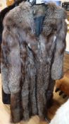 A full length silver fox coat