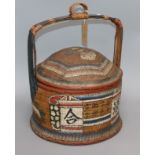 An Oriental painted wicker food carrier