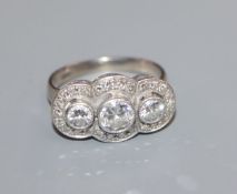 A 14k and diamond set triple cluster ring, with three central collet set round brilliant cut stones,