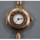 A lady's early 20th century 9ct Rolex half hunter manual wind wrist watch, on a yellow metal