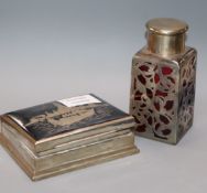 A Thai white metal cigarette case and a white metal over glass scent bottle.