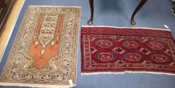 A Bokhara rug and a prayer rug Larger 132 x 94cm