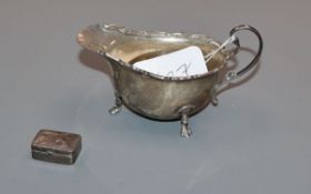 A George V silver sauceboat, Birmingham, 1929 and a modern silver pill box.