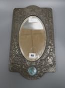 An Art Nouveau pewter overlaid wall mirror with Ruskin style plaque length 41cm