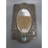 An Art Nouveau pewter overlaid wall mirror with Ruskin style plaque length 41cm