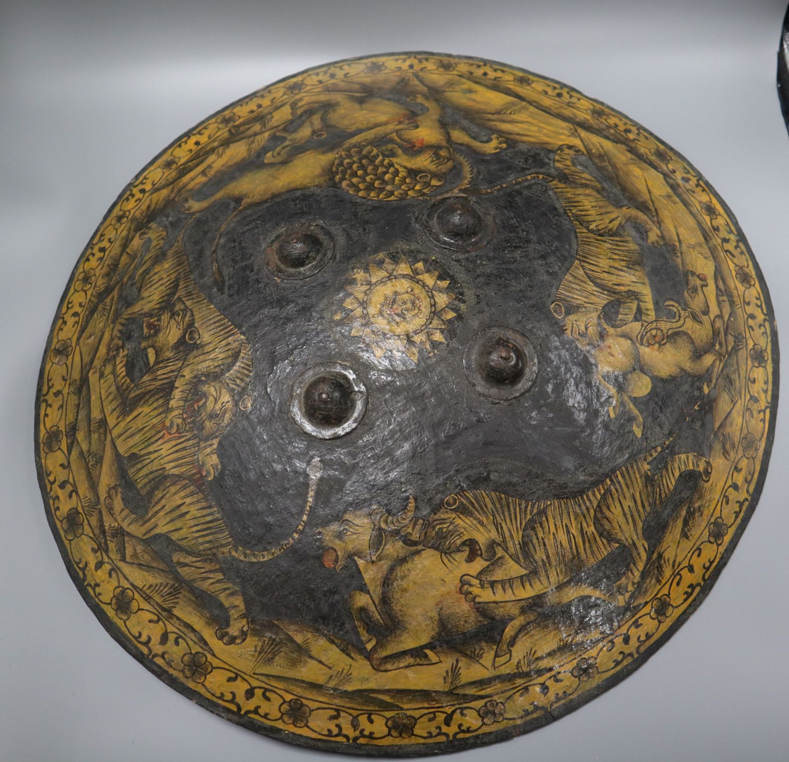 An Indian papier mache shield, depicting hunting tigers and a lion diameter 55cm - Image 2 of 2