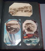 A 20th century postcard album, including comic, Ypres war damage, greetings, topographical and other