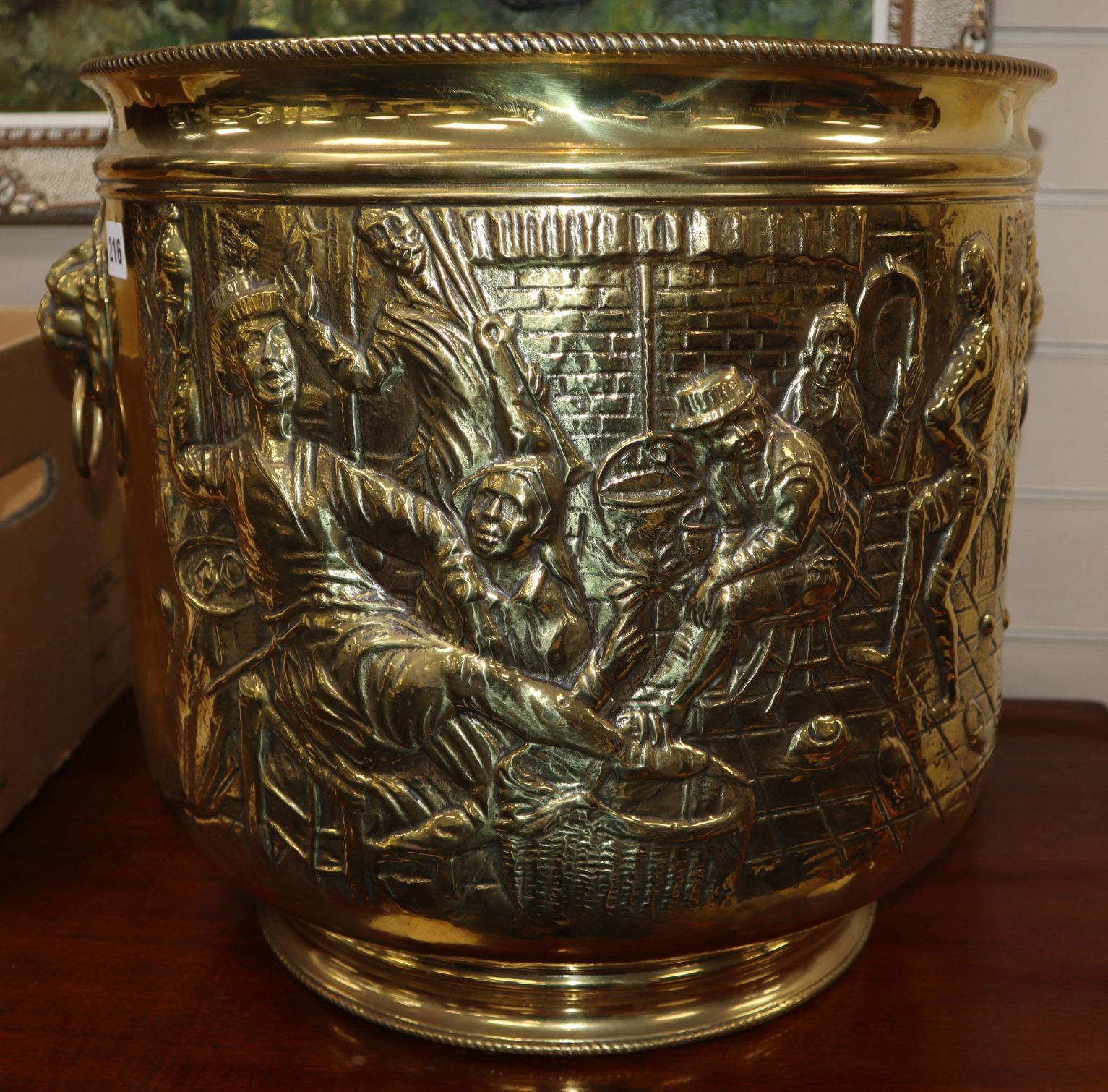 A large brass embossed jardiniere height 41cm