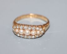 A late Victorian 18ct gold, diamond and split pearl set cluster ring, size O.