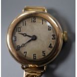An early 20th century gold plated manual wind watch, the movement signed Rolex, on a 9ct expanding