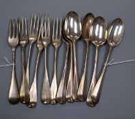 A set of six Victorian silver Old English and Rat-tail pattern dessert spoons and six matching
