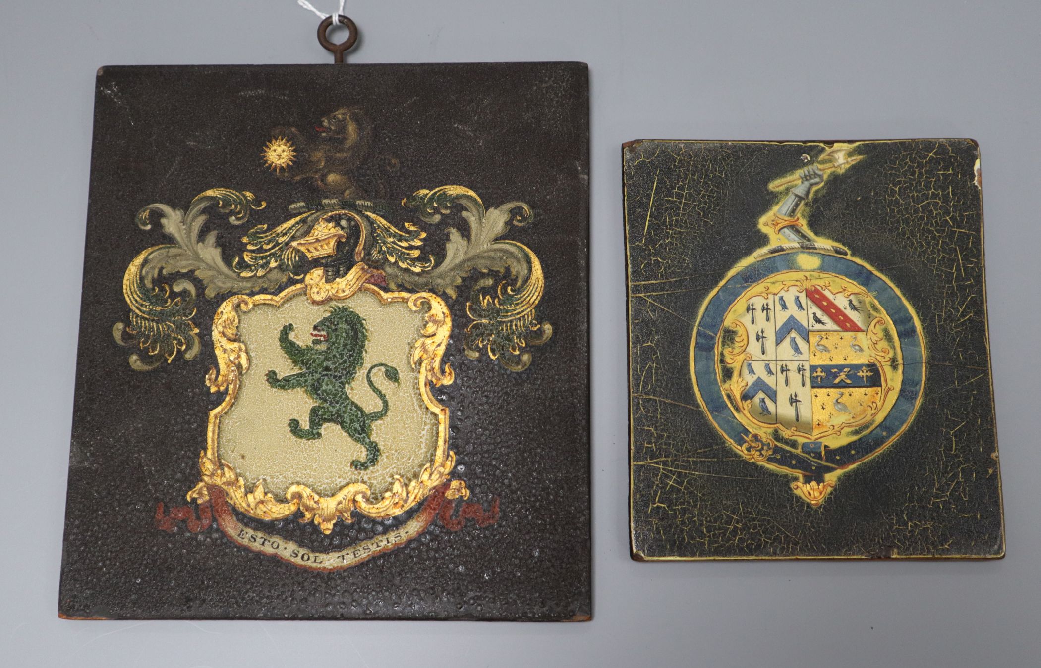 Two small painted hatchments largest 19 x 17cm