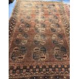 A Bokhara brown ground carpet 316 x 211cm