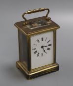 A gilt brass carriage timepiece having white enamelled dial