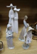 A Lladro figure of two nuns, another of a fairy godmother and three other Lladro figures tallest