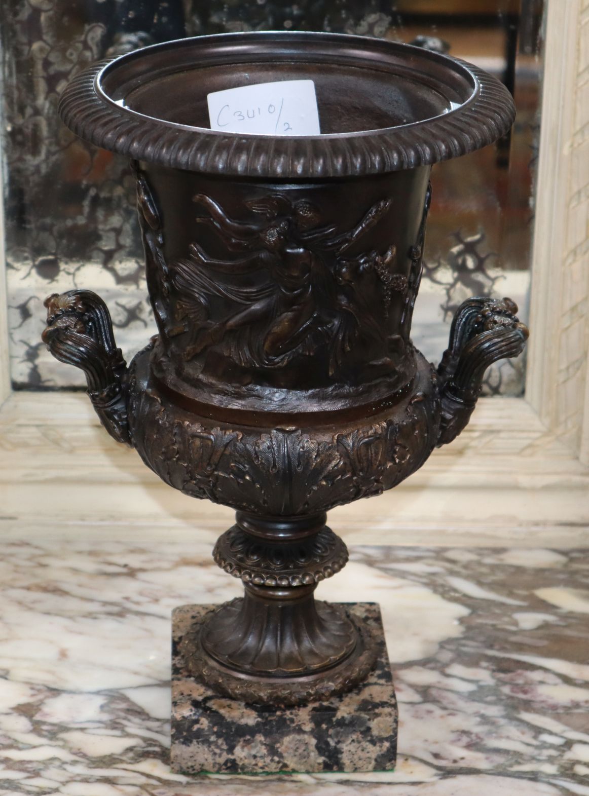 A bronze urn on stand