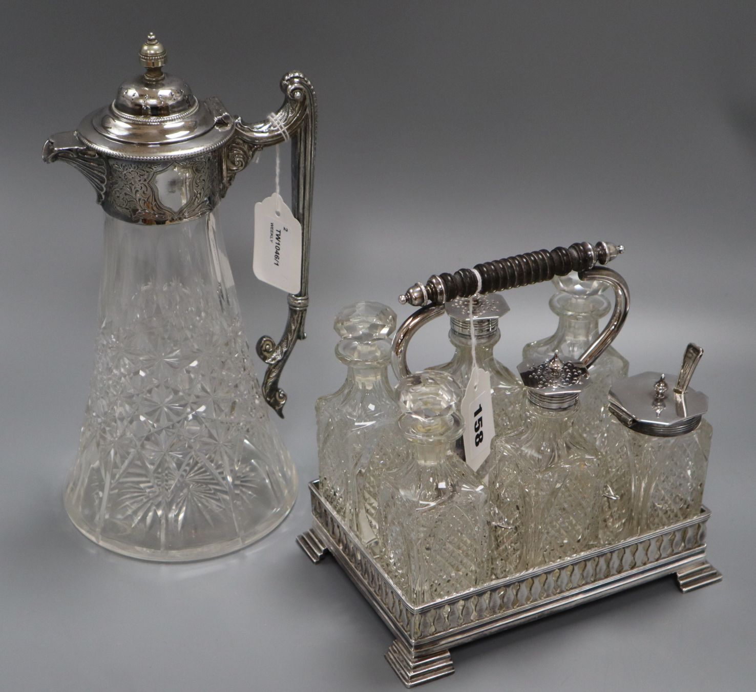 A cut glass claret jug with silver-plated mounts and a six-bottle plated cruet set - Image 2 of 2