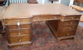 An early 20th century oak pedestal partner's desk W.186cm