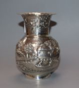An Indian white metal small vase, embossed with landscape scene, 10.1cm.