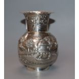 An Indian white metal small vase, embossed with landscape scene, 10.1cm.