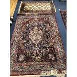 A Kashan style rug and a Bokhara rug Larger 202 x 141cm