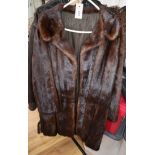 A three quarter length mink coat