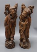 A pair of Chinese carved hardwood figures of sages height 53cm