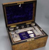 A walnut toilet case with plate-mounted fitments and jewellery drawer