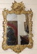 A carved giltwood and gesso wall mirror H.98cm