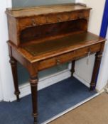 A Victorian burr walnut five drawer writing table with leather inset top W.90cm