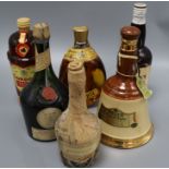 Six assorted spirits including Bells