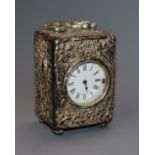 A late Victorian repousse silver cased miniature carriage timepiece by William Comyns, London, 1898,