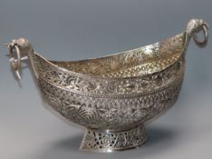 A Kashmiri white metal ring handled kashkul bowl, 27cm over handles, 12 oz.