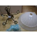 An opaque light bowl and a copper light fitting