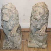 A pair of reconstituted stone lion garden ornaments H.36cm