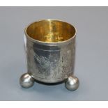 A late 18th century Russian white metal tot beaker on ball feet, dated 1781, 5cm.