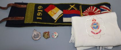 An RAF pilots scarf, a belt and assorted badges