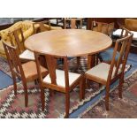 A Gordon Russell oak drop flap dining table and eight Enstone oak chairs