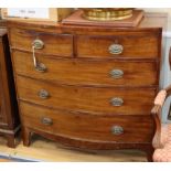 A Regency mahogany bow-fronted chest fitted two short drawers and three long drawers on bracket feet