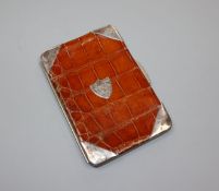 A late Victorian silver mounted crocodile skin wallet, London, 1899, 13.8cm.