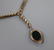 A 9c fancy twisted-link pendant necklace with shaped oval seal drop set bloodstone and agate