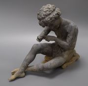 A lead garden figure of a seated boy height 27cm