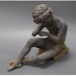 A lead garden figure of a seated boy height 27cm