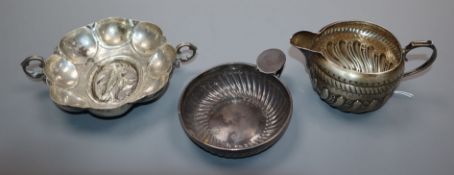 Two white metal taste du vin including French and a Victorian silver cream jug.