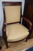 An early 19th century French mahogany elbow chair